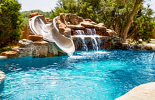 swimming-pool-with-rock-waterfall-slide