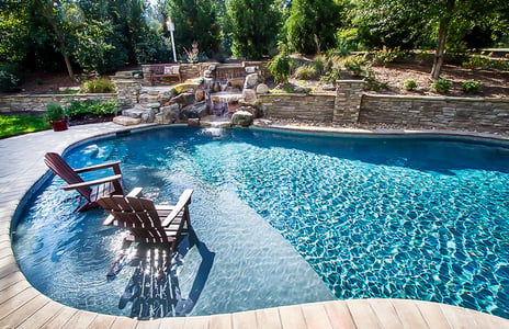 swimming-pool-with-tanning-ledge-and-rock-waterfall