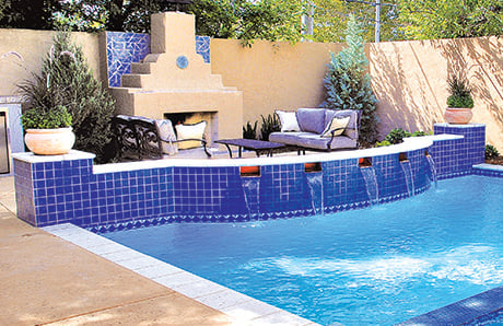 swimming_pool_wiht_outdoor_fireplace_and_seating_area.jpg