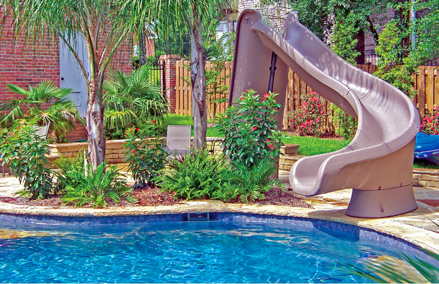 tan-curved-inground-pool-slide-with-landscape