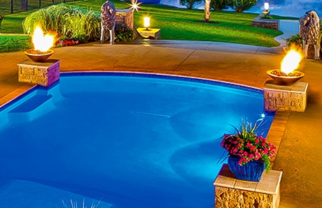 twin-fire-bowls-atop-pedestals-on-swimming-pool