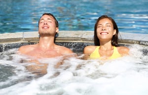 young-couple-enjoying-spa-hydrotherapy