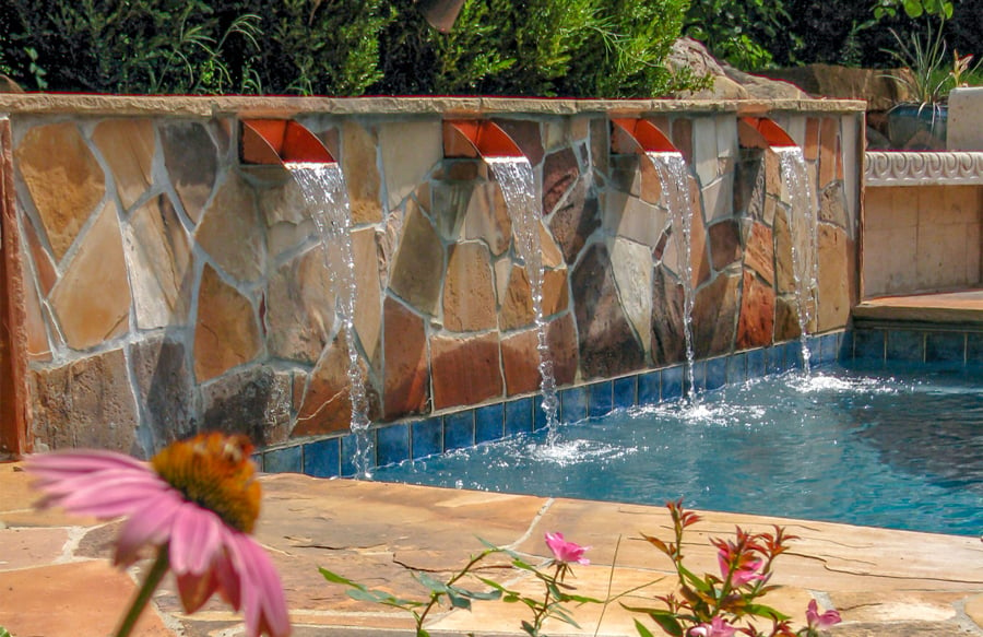 copper-scuppers-on-flagstone-feature-wall-on-custom-pool