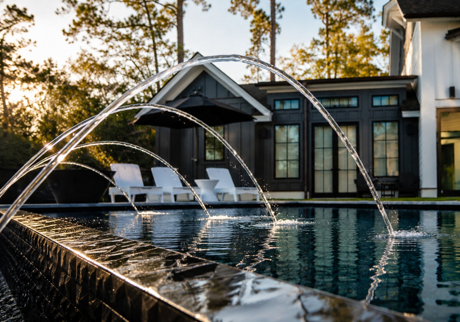 10 Swimming Pool Water Feature Ideas (Besides Rock Waterfalls)