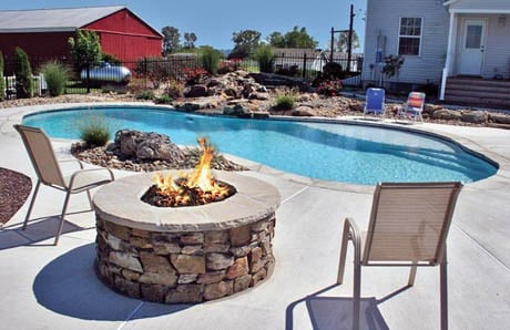 Round fire pit with fieldstone and lava rock