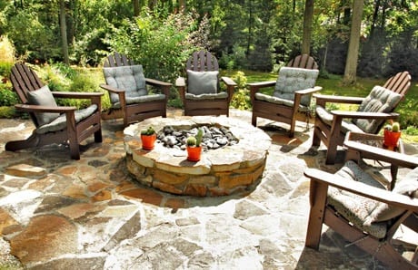 Rustic fire pit with stone to match pool deck