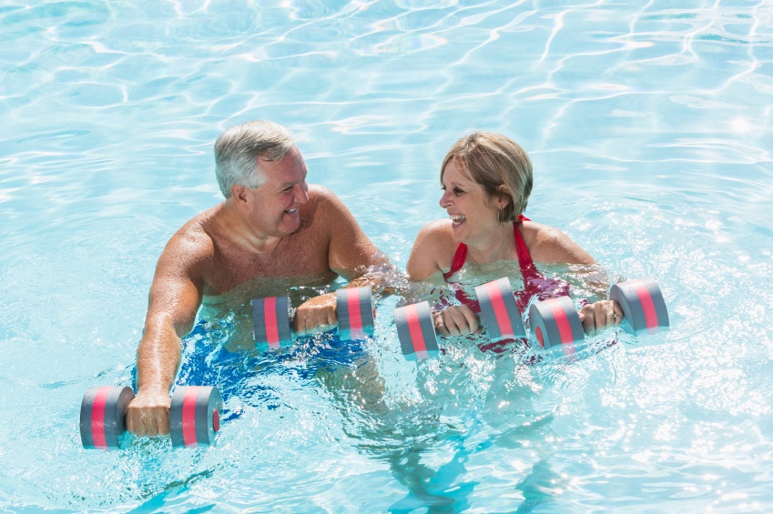 Two people doing swimming pool exercises
