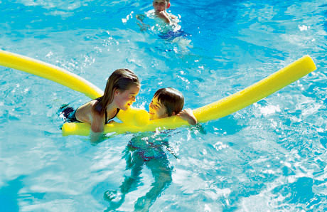 children playing in swimming pool