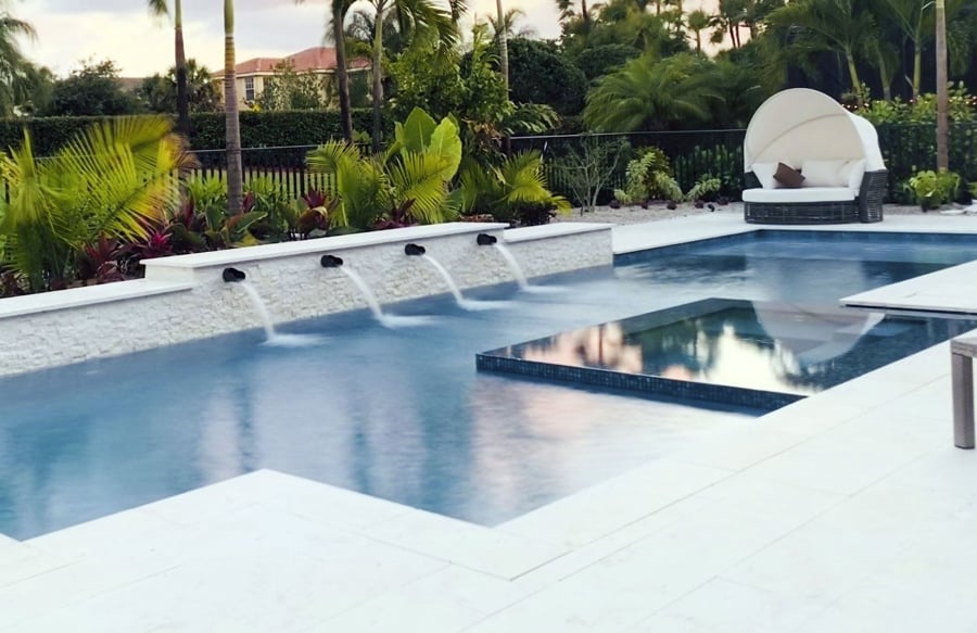 row-of-decorative-spouts-on-sleek-pool