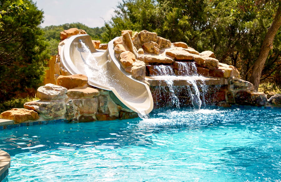 stone-waterfall-grotto-slide-on-swimming-pool